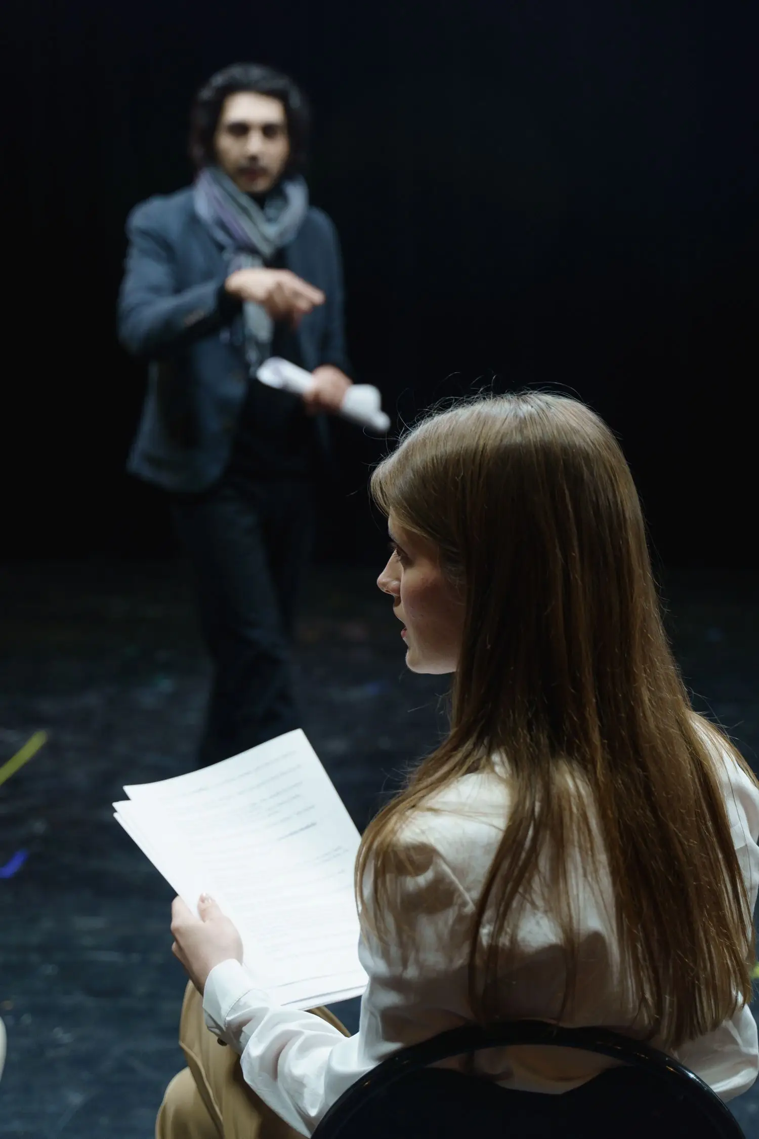Actors reviewing pages during rehearsal