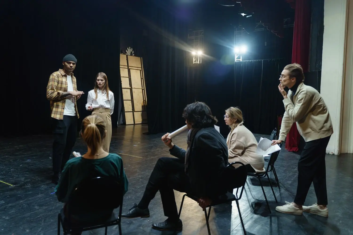 Actors collaborating in a black box rehearsal room