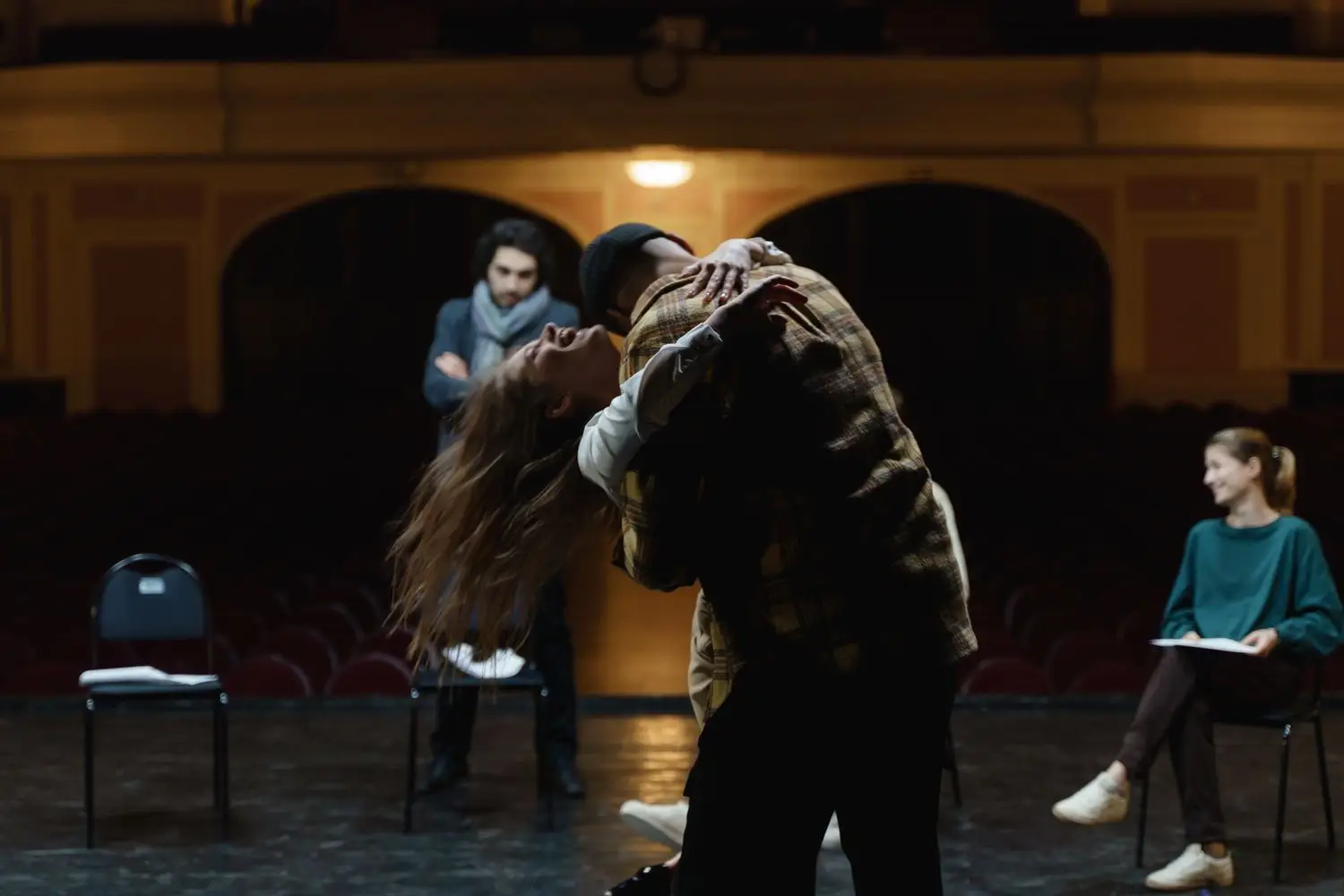 Actors rehearsing physical movement on stage